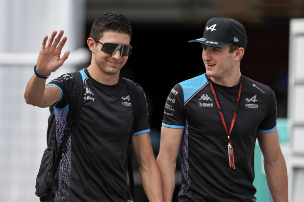 Esteban Ocon and Jack Doohan of Alpine F1 arrive at the track during practice ahead of the F1 Grand Prix of Japan at Suzuka Circuit in 2023.