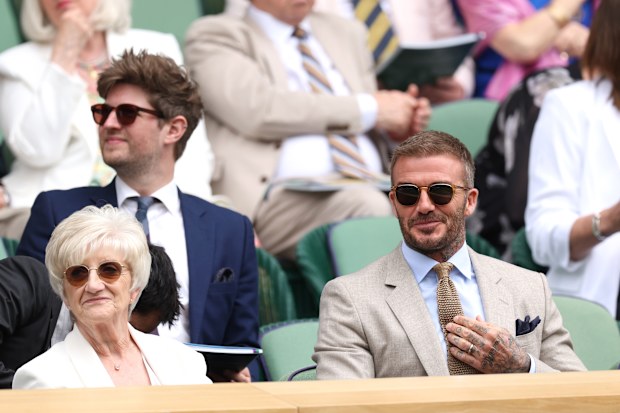 LONDON, ENGLAND - JULY 01: David Beckham and Mrs Sandra Beckham are seen in the Royal Box ahead of the Gentlemen's Singles first round match between Carlos Alcaraz of Spain and Dusan Lajovic of Serbia during day one of The Championships Wimbledon 2024 at All England Lawn Tennis and Croquet Club on July 01, 2024 in London, England. (Photo by Clive Brunskill/Getty Images)