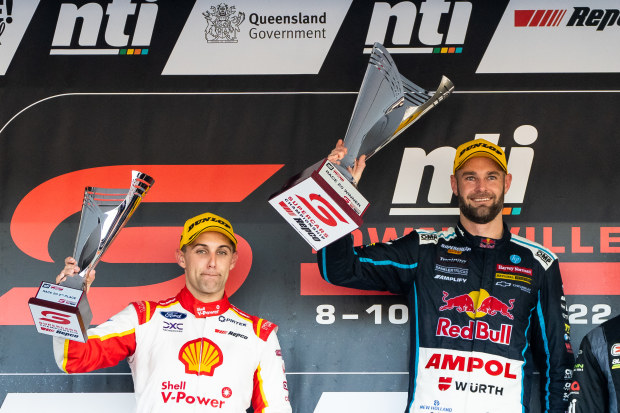 Anton de Pasquale driver of the #11 Shell V-Power Racing Ford Mustang and Shane van Gisbergen driver of the #97 Red Bull Ampol Holden Commodore ZB are pictured on the podium during race 2 of the Townsville 500 round of the 2022 Supercars Championship Season at Reid Park on July 10, 2022 in Townsville, Australia. (Photo by Daniel Kalisz/Getty Images)
