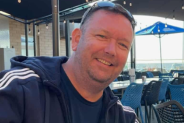 Chris Robertson has been identified as the 49-year-old found dead at a workshop on O'Sullivan's Beach Road in Lonsdale, an industrial suburb in Adelaide, yesterday. 