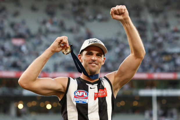 Scott Pendlebury celebrates his second premiership medal.