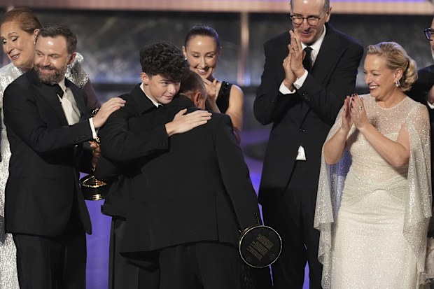 Philip Barantini, from left, Owen Cooper, Stephen Graham, Erin Doherty, Jack Thorne, and Christine Tremarco accept the award for outstanding limited or anthology series for "Adolescence" during the 77th Primetime Emmy Awards on Sunday, Sept. 14, 2025, at the Peacock Theater in Los Angeles. 
