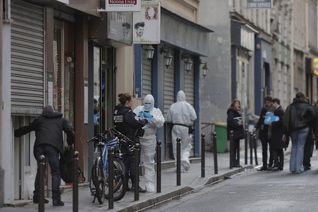 Police investigate at the scene where a shooting took place in Paris, Friday, Dec. 23, 2022. 