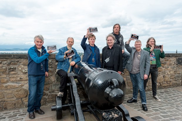 Runrig band members Malcolm 'Calum' Macdonald, Malcolm Jones, Roderick 'Rory' Macdonald, Castle Concert director Barry Wright,  Bruce Guthro, Iain Bayne and Brian Hurren attend a photocall prior the concert to celebrate a record breaking 6th sold out show at  Edinburgh Castle on July 23, 2016