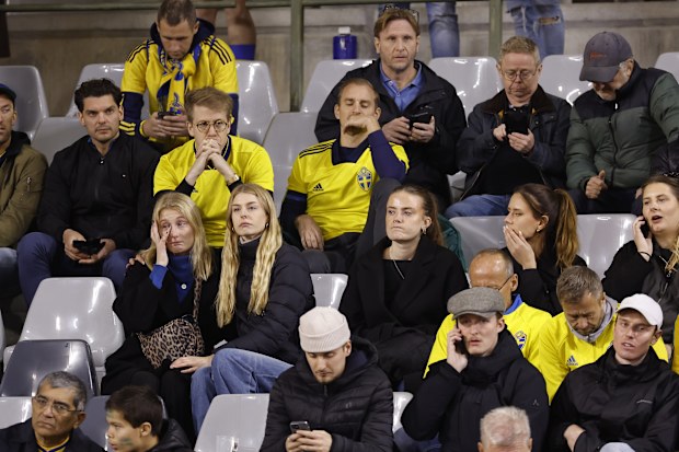 Sweden supporters sit in the stands at King Baudouin Stadium in Brussels.