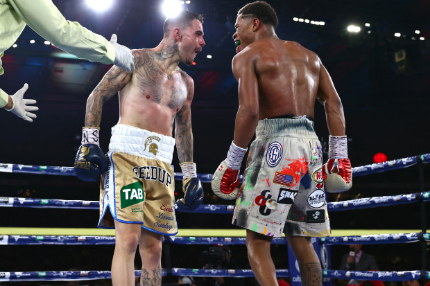 George Kambosos Jnr and Devin Haney stare at each other during their World Lightweight Undisputed Championship fight, at Marvel Stadium.