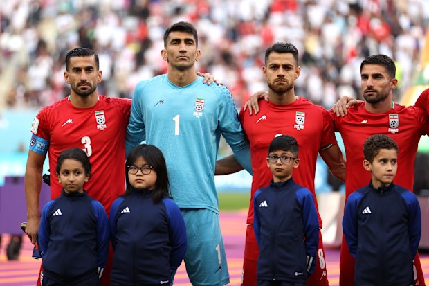 DOHA, QATAR - NOVEMBER 21: Iran players line up for the national anthem prior to the FIFA World Cup Qatar 2022 Group B match between England and IR Iran at Khalifa International Stadium on November 21, 2022 in Doha, Qatar. (Photo by Julian Finney/Getty Images)