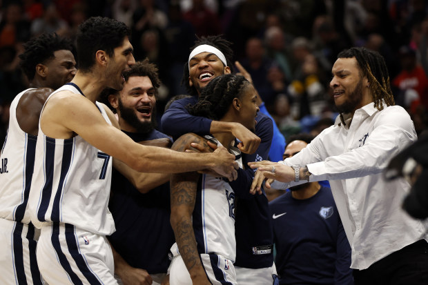 NEW ORLEANS, LOUISIANA - DECEMBER 19: Ja Morant #12 of the Memphis Grizzlies reacts with his team after defeating the New Orleans Pelicans at Smoothie King Center on December 19, 2023 in New Orleans, Louisiana. 