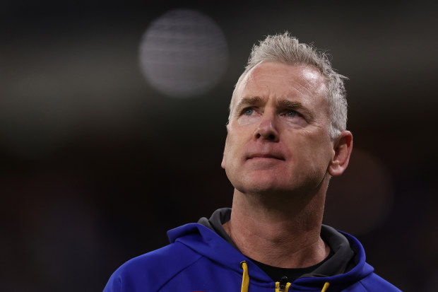PERTH, AUSTRALIA - AUGUST 12: Adam Simpson, head coach of the Eagles looks to the scoreboard while walking to the rooms at the half time break during the round 22 AFL match between West Coast Eagles and Fremantle Dockers at Optus Stadium, on August 12, 2023, in Perth, Australia. (Photo by Paul Kane/Getty Images)