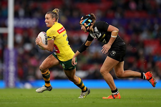 Ali Brigginshaw of Australia breaks away from Page McGregor of New Zealand during the Women's Rugby League World Cup Final match between Australia and New Zealand at Old Trafford on November 19, 2022 in Manchester, England. (Photo by Lewis Storey/Getty Images for RLWC)