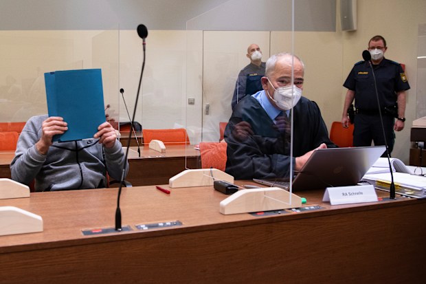 The man is accused of murder in the death of one man and mutilating several others by performing illegal operations on their genitals. (Sven Hoppe/dpa via AP)