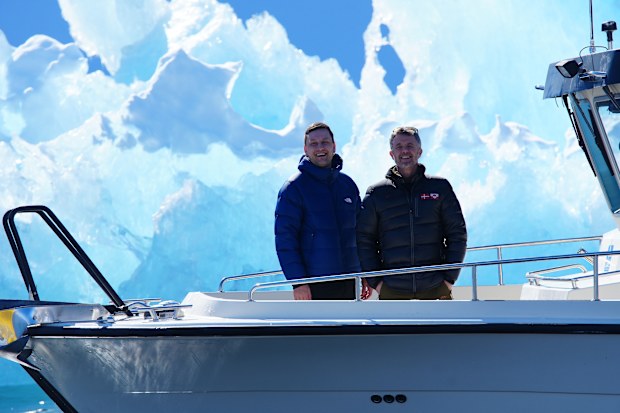 Denmark's King Frederik, right, and Greenland's head of government Jens-Frederik Nielsen in front of a iceberg during a boat trip in Nuuk fjord, in Greenland, Tuesday April 29, 2025. (Ida Marie Odhaard/Ritzau Scanpix via AP)