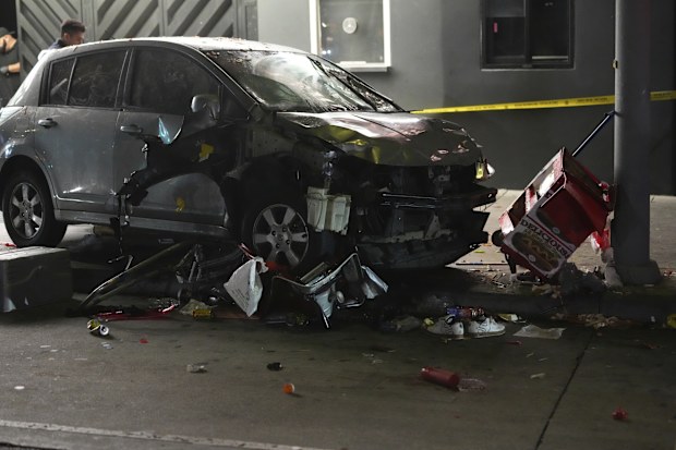 A driver rammed into a crowd of people waiting to enter a nightclub along a busy boulevard in Los Angeles