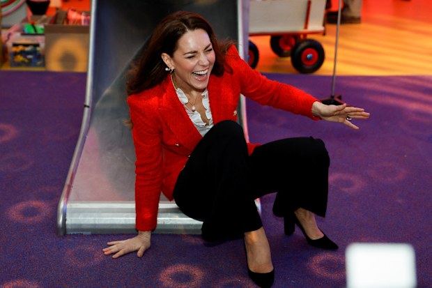 Kate Middleton, Duchess of Cambridge reacts as she slides down a slide during a visit at the LEGO Foundation PlayLab on February 22, 2022 in Copenhagen, Denmark.