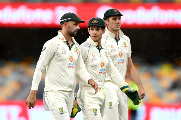 Tim Paine and Nathan Lyon leaving the field. 
