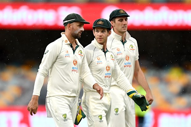 Tim Paine (centre) with Nathan Lyon and Pat Cummins of Australia.