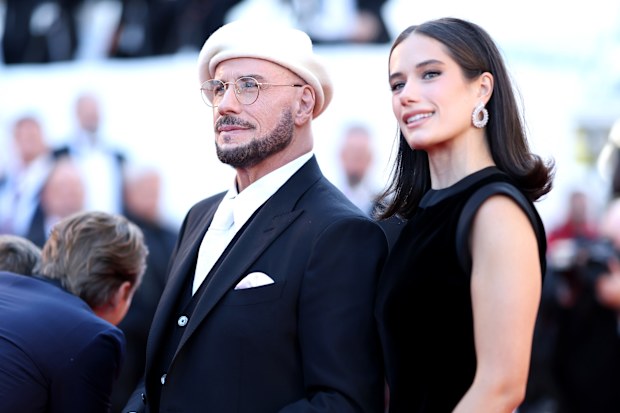 John Travolta and Ella Bleu Travolta attend the "Karma" screening during the 79th annual Cannes Film Festival at Palais des Festivals on May 15, 2026 in Cannes, France. 