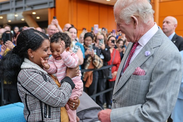 BIRMINGHAM, ENGLAND - SEPTEMBER 3: King Charles III talks with Semher Tesfu who is holding her baby Hernata Yonas as King Charles III officially opened Midland Metropolitan University Hospital (MMUH), which comprises 736 beds, eleven operating theatres, an Accident and Emergency department, diagnostic suites and research and education on September 3, 2025 in Birmingham, England. (Photo by Richard Pohle - WPA Pool/Getty Images)