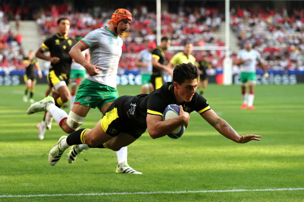 Louis Rees-Zammit of Wales scores his team's first try.