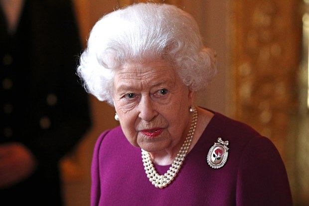 The Queen arrives to join members of the Order of Merit for a group photograph.