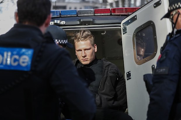The Age, News, 02/09/2025. Nathan Bull, member of the neo-Nazi group National Socialist Network is arrested by Victoria Police outside the Melbourne Magistrates' Court for his role in the attack on Camp Sovereignty on Sunday.