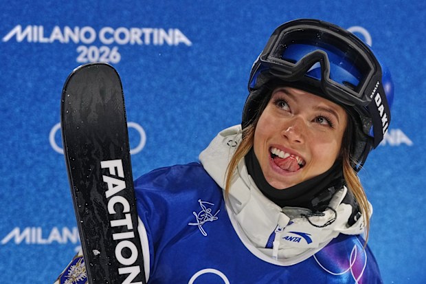 China's Eileen Gu reacts during the women's freestyle skiing halfpipe qualifications at the 2026 Winter Olympics, in Livigno, Italy, Thursday, Feb. 19, 2026. (AP Photo/Gregory Bull)