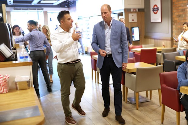 Prince William, Prince of Wales speaks to Pret CEO Pano Christou during a visit to Pret A Manger on September 07, 2023 in Bournemouth, England. 