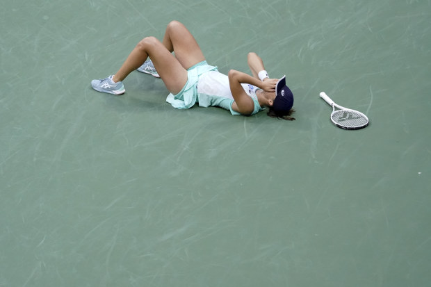 Iga Swiatek, of Poland, reacts after defeating Ons Jabeur, of Tunisia, to win the women's singles final of the U.S. Open tennis championships, Saturday, Sept. 10, 2022, in New York. (AP Photo/Mary Altaffer)