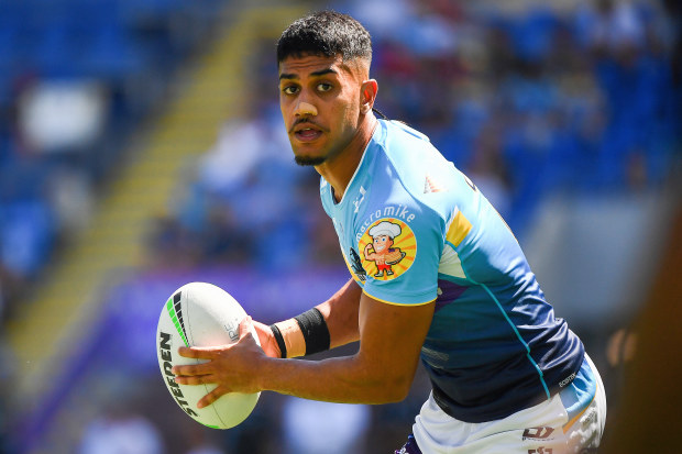 Alofiana Khan-Pereira of the Titans passes the ball at warm up during the round three NRL match between the Gold Coast Titans and the Melbourne Storm at Cbus Super Stadium on March 18, 2023 in Gold Coast, Australia. (Photo by Jono Searle/Getty Images)