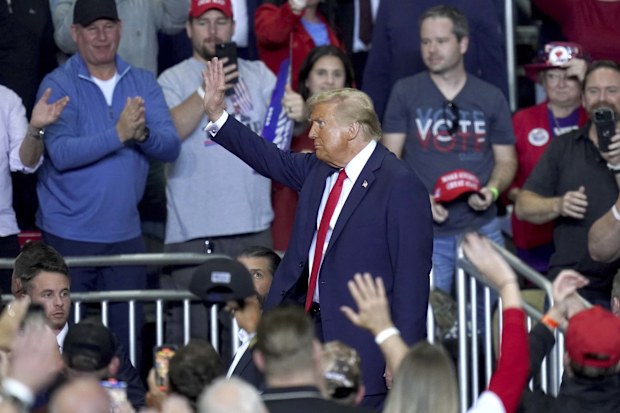 Republican presidential nominee former President Donald Trump waves after speaking at a campaign rally at PPG Paints Arena, Monday, Nov. 4, 2024, in Pittsburgh. (AP Photo/Matt Freed)