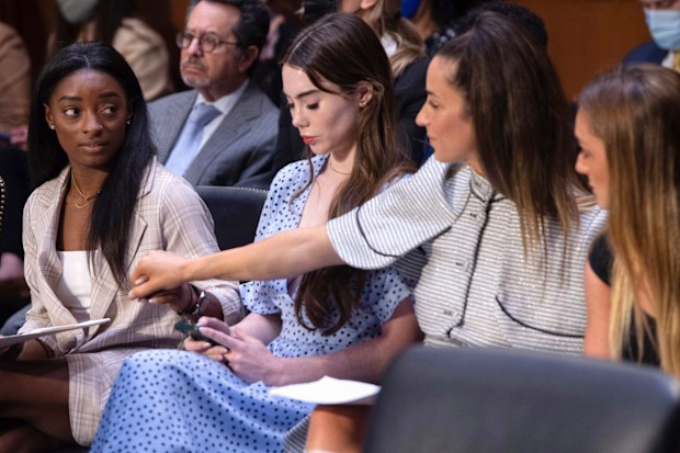 U.S. gymnasts from left, Simone Biles, McKayla Maroney, Aly Raisman and Maggie Nichols, arrive to testify during a Senate Judiciary hearing about the Inspector General's report on the FBI's handling of the Larry Nassar investigation on Capitol Hill. 