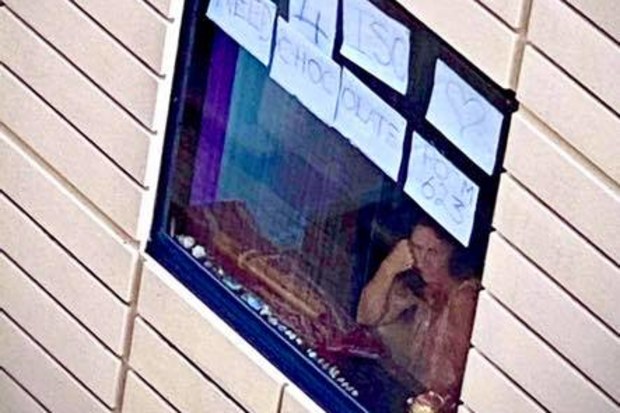 'Day 4 ISO need chocolate': Leeson and her hotel isolation sign.