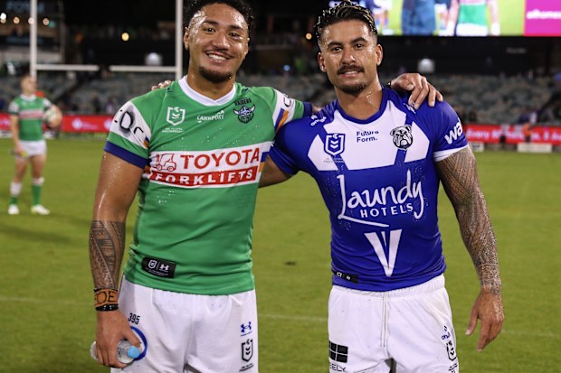 Raiders player Simi Sasagi poses with Bulldogs centre Enari Tuala after their round three clash.