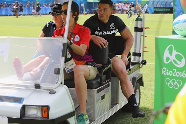 An injured Sonny Bill Williams of New Zealand is stretchered off.