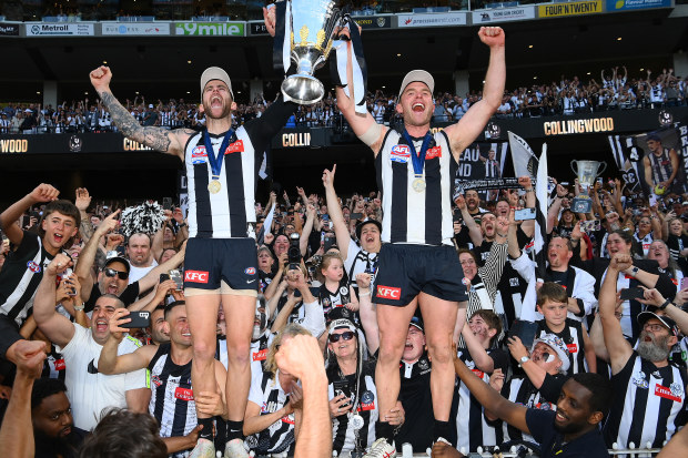 Jeremy Howe (left) and Tom Mitchell celebrate Collingwood's grand final victory over Brisbane.