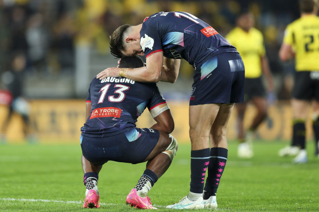 Filipo Daugunu and Lachie Anderson of the Rebels react after the final whistle.