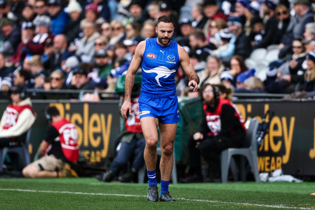 GEELONG, AUSTRALIA - JULY 09: Griffin Logue of the Kangaroos leaves the field injured during the 2023 AFL Round 17 match between the Geelong Cats and the North Melbourne Kangaroos at GMHBA Stadium on July 9, 2023 in Geelong, Australia. (Photo by Dylan Burns/AFL Photos via Getty Images)