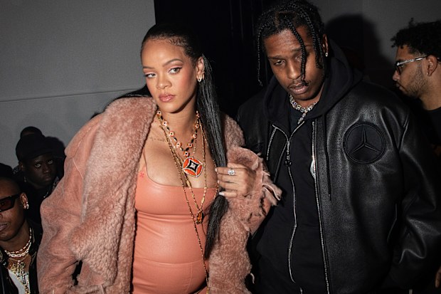 Rihanna, left, and ASAP Rocky arrive for the Off-White Ready To Wear Fall/Winter 2022-2023 fashion collection, unveiled during the Fashion Week in Paris, Monday, Feb. 28, 2022. (Photo by Vianney Le Caer/Invision/AP)