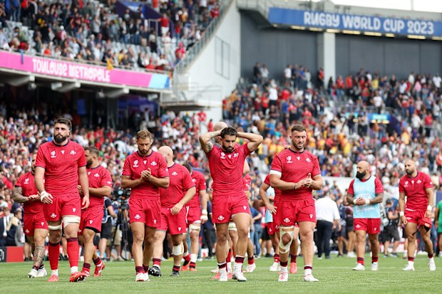 Stunned Georgia players wander after their drawn match against Portugal.