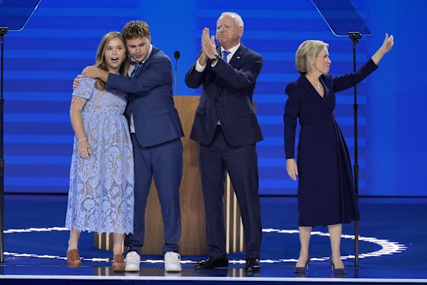 Tim Walz, second from right, poses with his wife Gwen Walz, from right, son Gus Walz and daughter Hope Walz