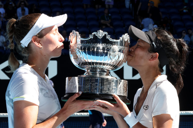 MELBOURNE, AUSTRALIA - JANUARY 28: Su-Wei Hsieh (R) of Chinese Taipei and Elise Mertens of Belgium pose with the championship trophy after winning their Womens Doubles Finals match against Lyudmyla Kichenok of Ukraine and Jelena Ostapenko of Latvia during the 2024 Australian Open at Melbourne Park on January 28, 2024 in Melbourne, Australia. (Photo by Darrian Traynor/Getty Images)