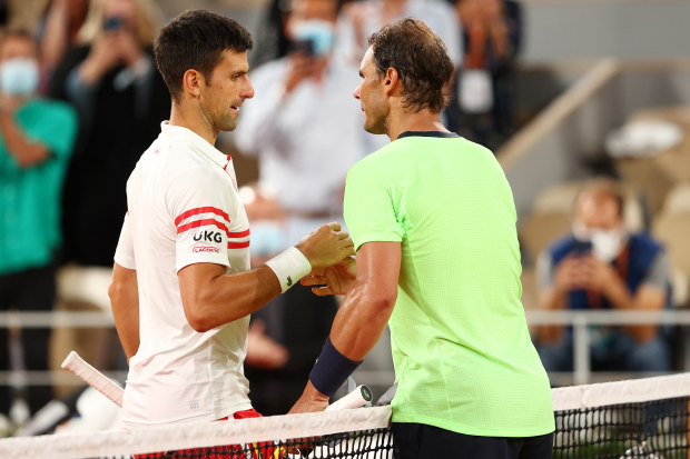 Novak Djokovic of Serbia shakes hands with Rafael Nadal of Spain.
