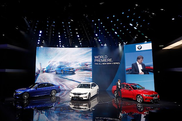 BMW 3 Series models are displayed at the presentation of the German car maker BMW at the Paris Motor Show 'Mondial de l'Automobile' in Paris.