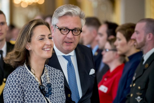 Belgium's Prince Laurent, center, and his wife Claire, left, arrive for a tribute ceremony at the Royal Palace in Brussels for the victims of the Brussels attacks on Sunday, May 22, 2016. 