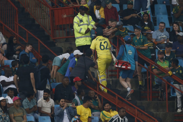 Travis Head leaves the field after receiving medical attention during the fourth ODI cricket match between South Africa and Australia in Pretoria.