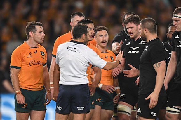 Referee Mathieu Raynal tries to calm things down.