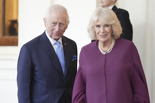 Britain's King Charles and Queen Camilla formally bid farewell to the Emir of Qatar Sheikh Tamim bin Hamad Al Thani and his wife Sheikha Jawaher as they leave Buckingham Palace in London, on the final day of their state visit to the UK, Wednesday Dec. 4, 2024. (Aaron Chown/PA via AP, Pool)