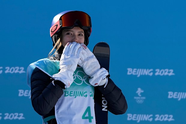 Eileen Gu, of China, reacts after winning gold.