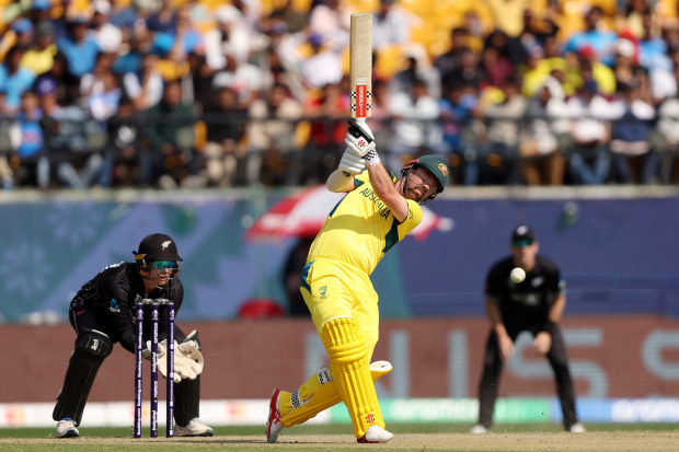 Travis Head dances down the wicket.