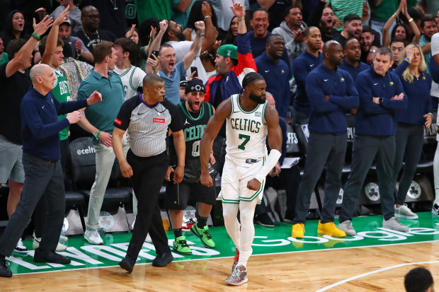 Jaylen Brown of the Boston Celtics reacts after making a three to tie the game late.